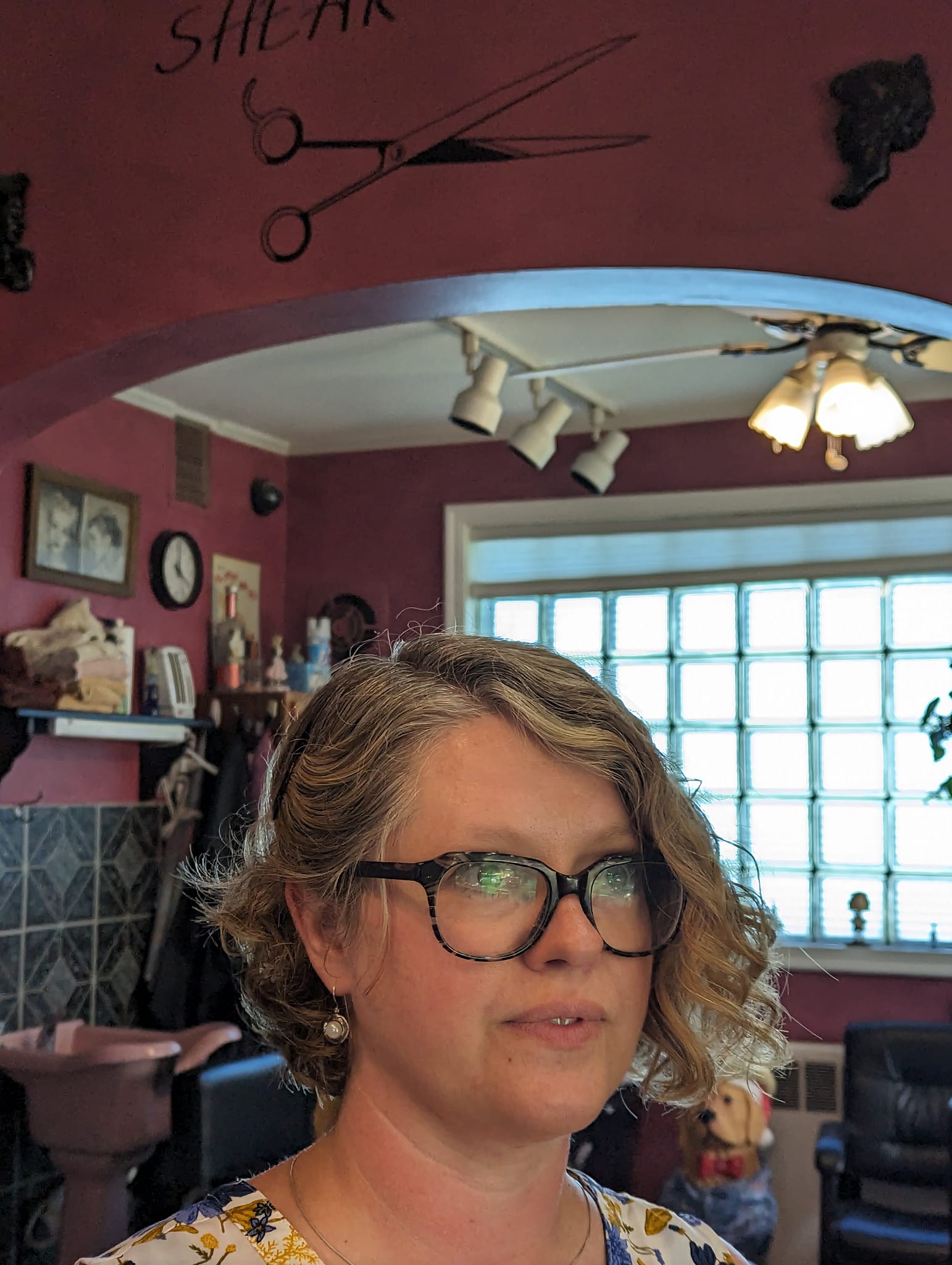 A Shear Delight client at the salon after a haircut